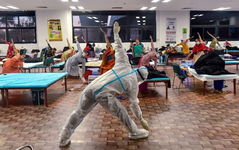  New Delhi: Patients perform yoga at CWG village COVID-19 Care Centre, near Akshardham in New Delhi, Sunday, Sept. 27, 2020. (PTI Photo/Manvender Vashist)